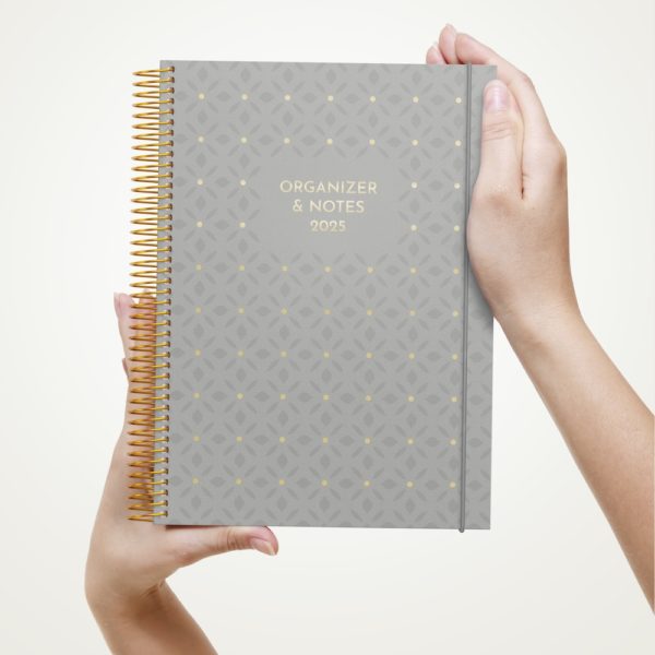 Woman hands showing blank notebook over white background